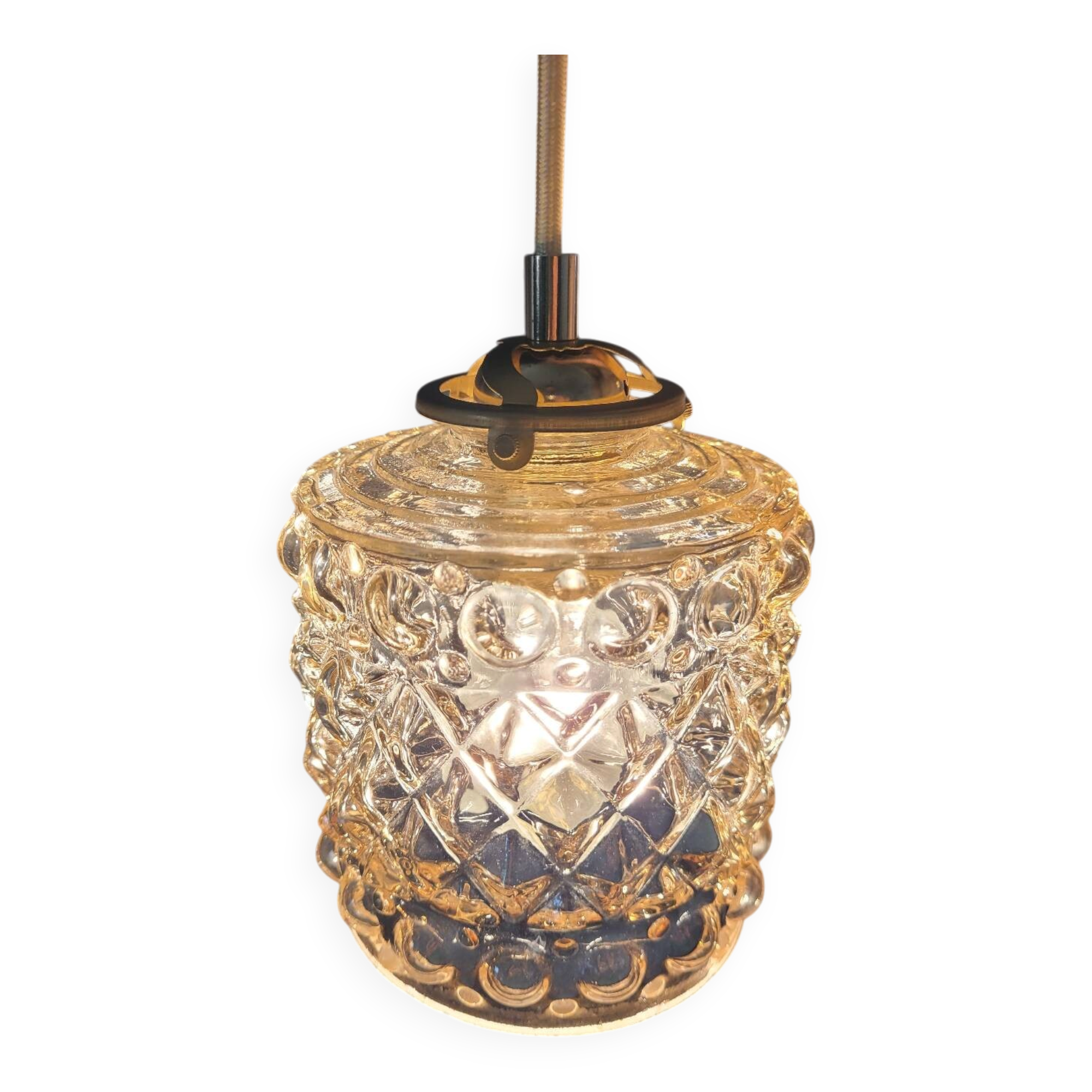 Moulded glass lamp with a cubic-spherical relief design.