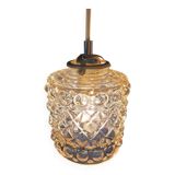 Moulded glass lamp with a cubic-spherical relief design.
