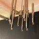 Scoliari chandelier with 18 bright nickel dots distributed by Boulanger