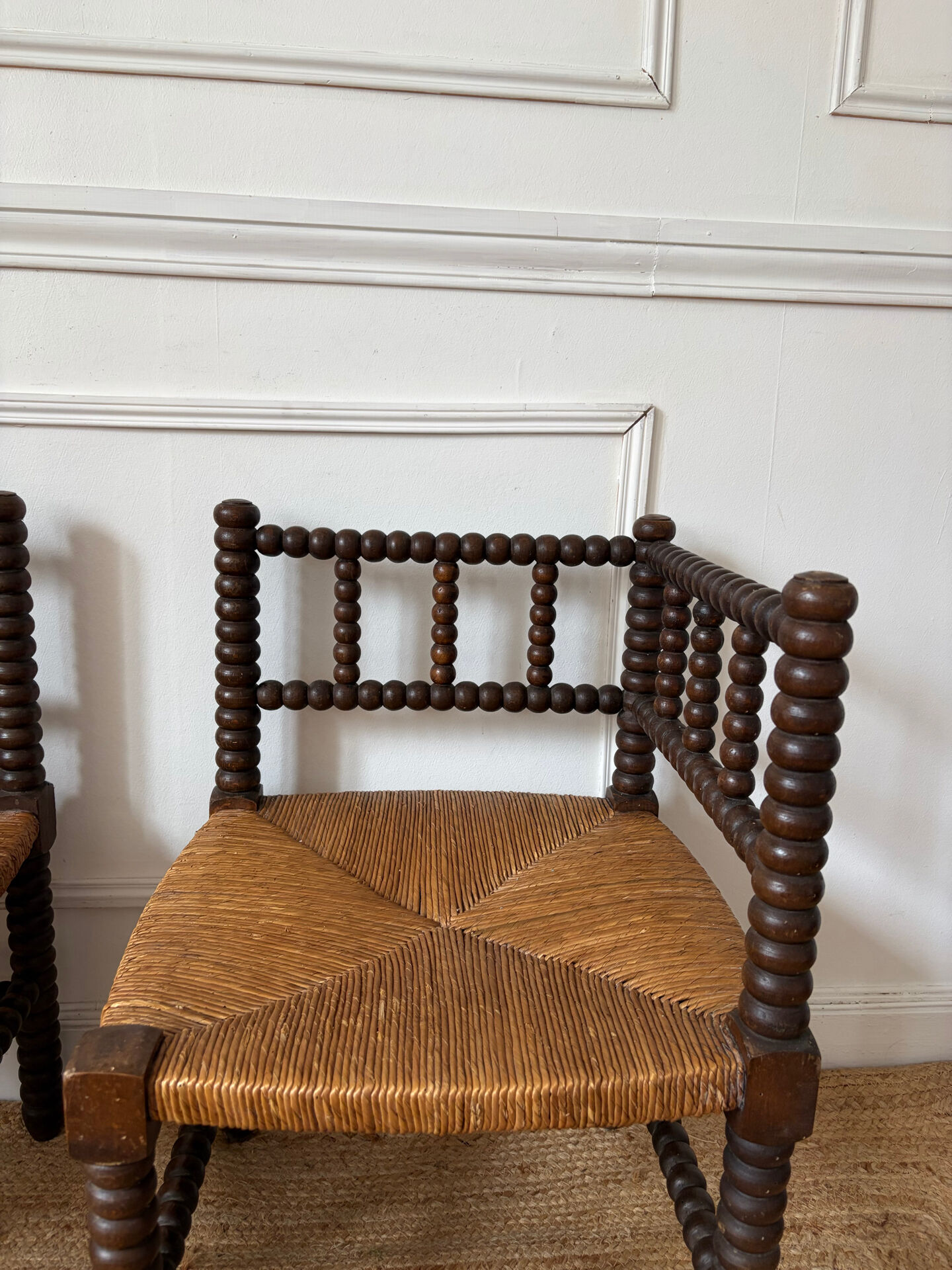 Pair of rush-seated chairs by the fireside "bobbin"
