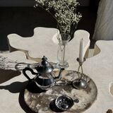 Silver-plated teapot with black handle