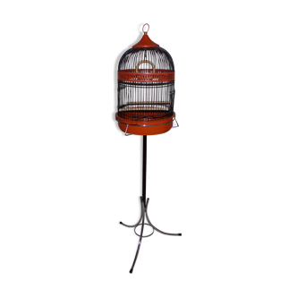 Old metal bird cage on foot