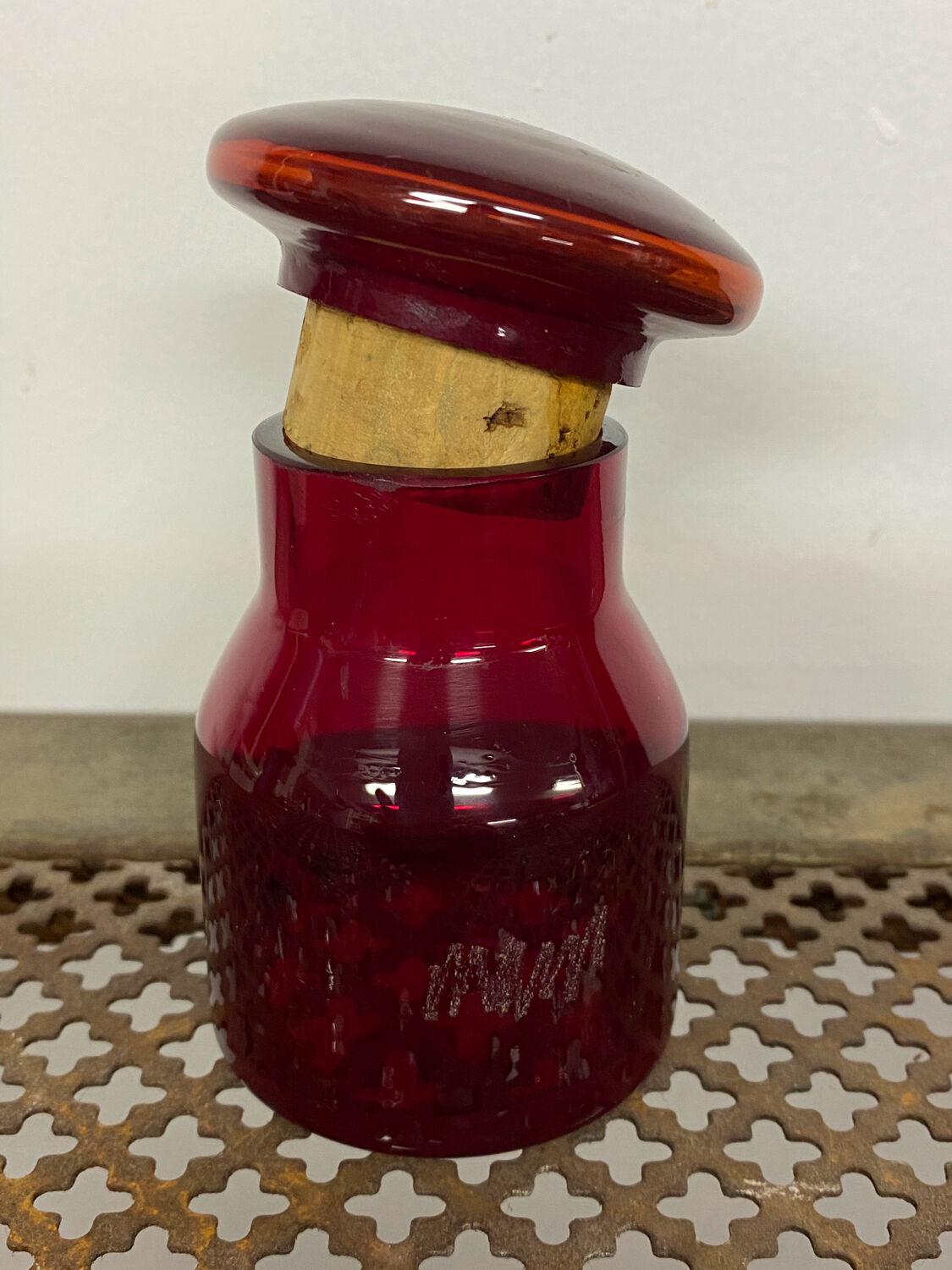 Red glass bottle