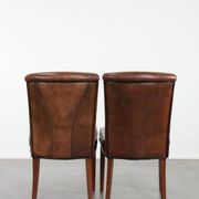 Comfortable set of 2 sheep leather dining chairs with character