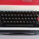 Typewriter "Burelec 315" made in Spain in red and white metal.