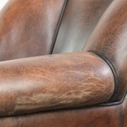 Vintage sheepskin armchair with a unique design and timeless appearance