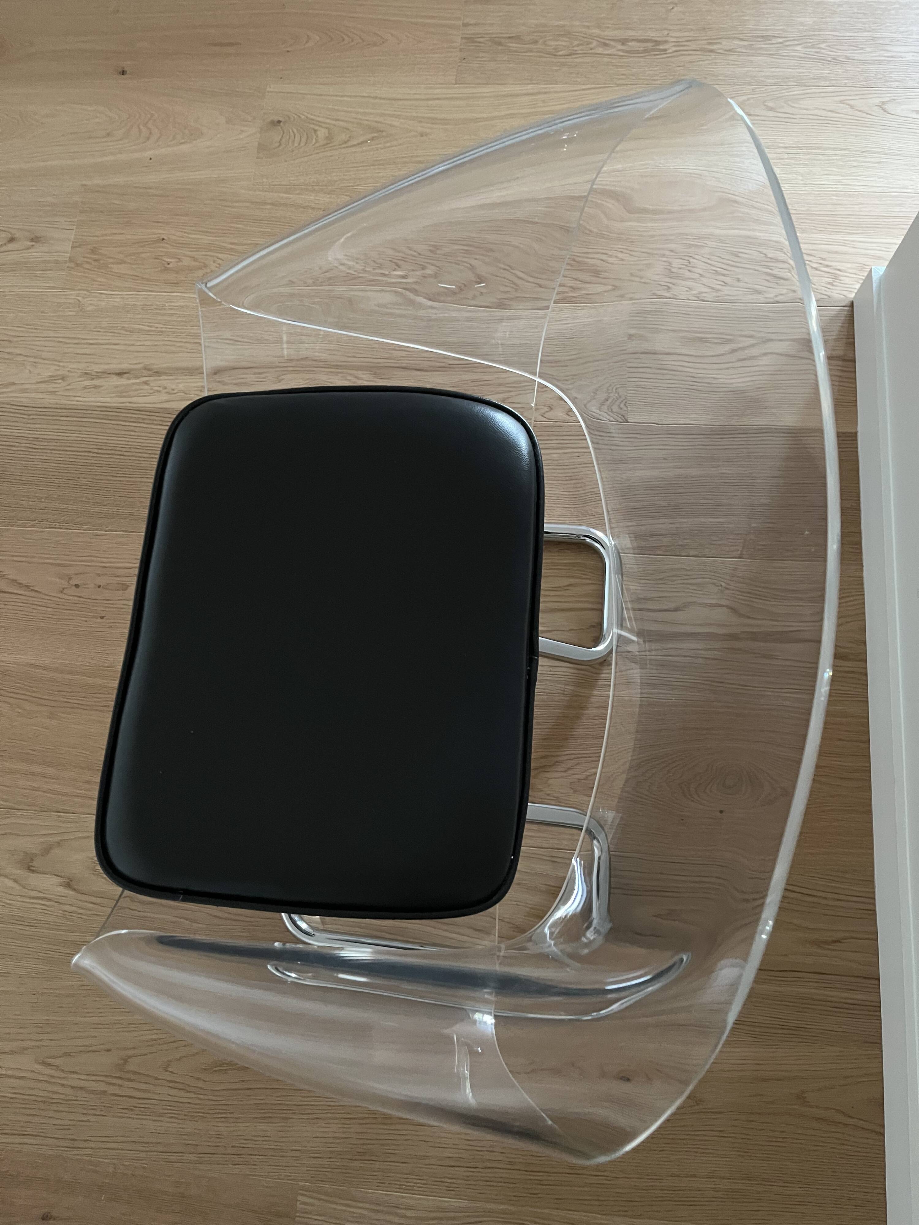 1970s chairs in acrylic and metal designed by Harvey Guzzini.