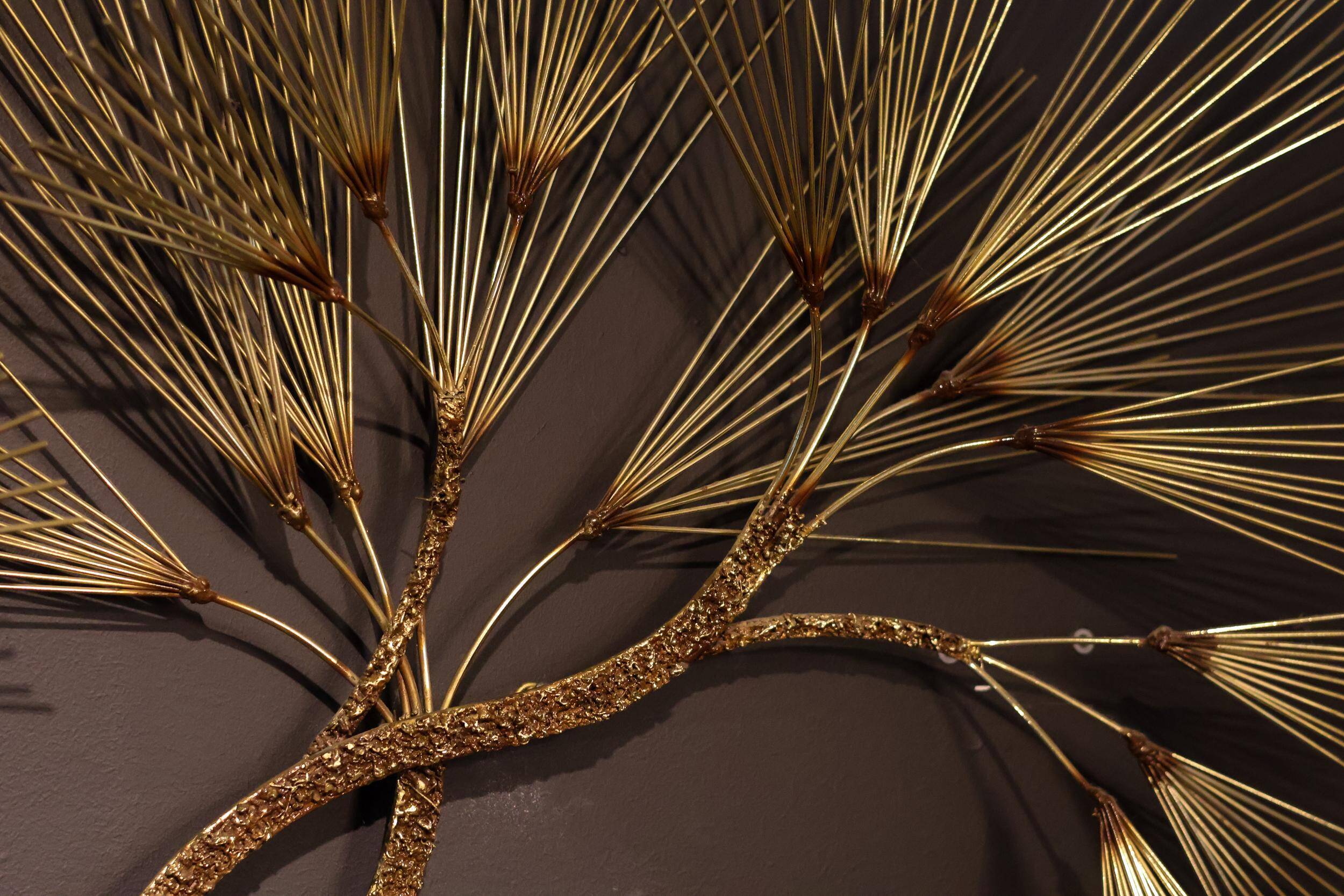 Large wall sculpture in the shape of a tree needle in brass by Curtis Jeré, mid-century modern.