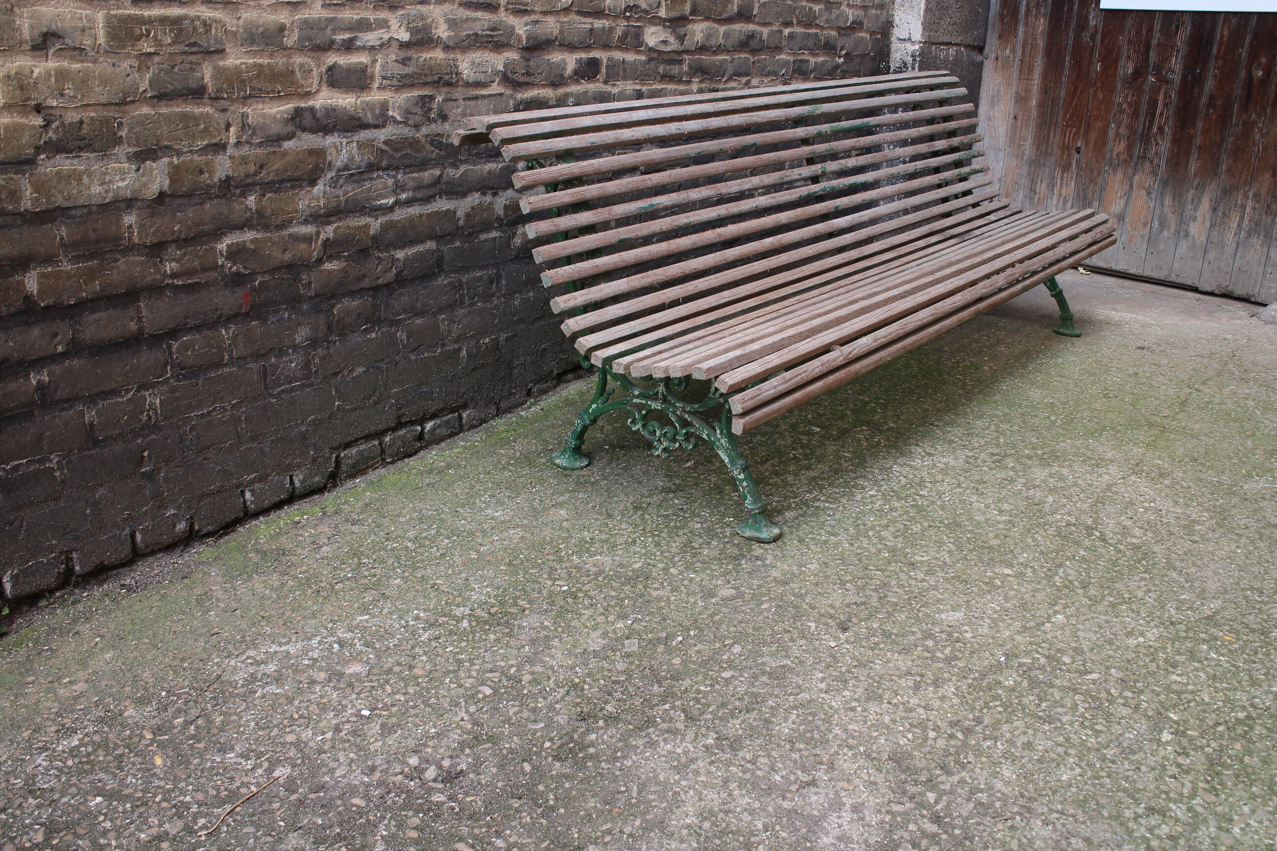 Old bench cast iron base and wooden slats