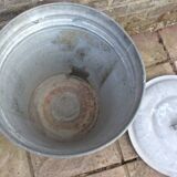 Old galvanized zinc trash can with lid