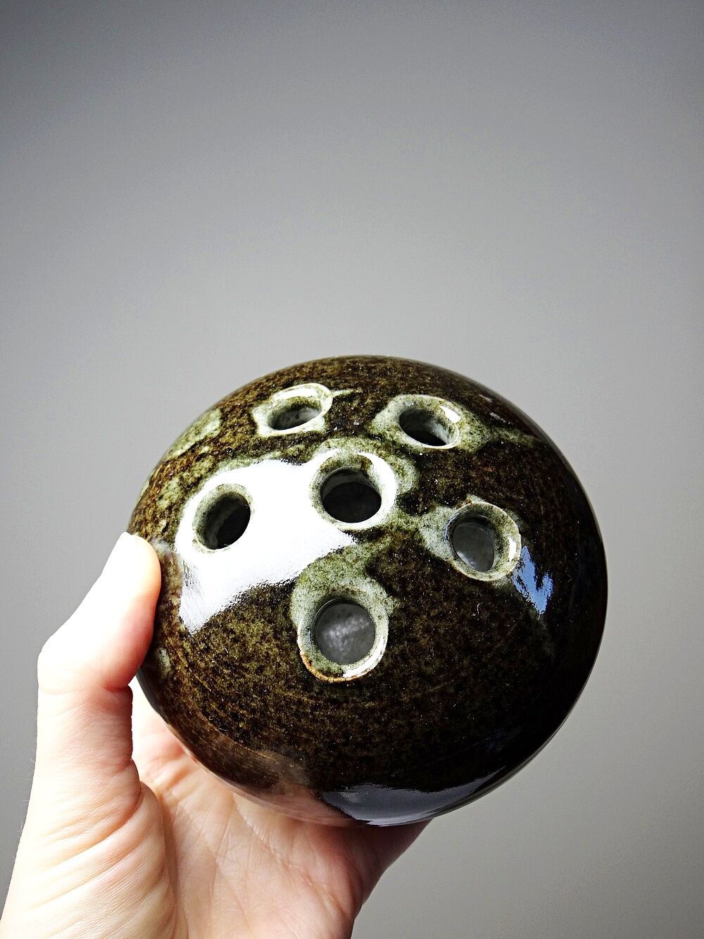 Brown and green glazed stoneware flower holder, vintage craftsmanship from the 1970s-1980s.