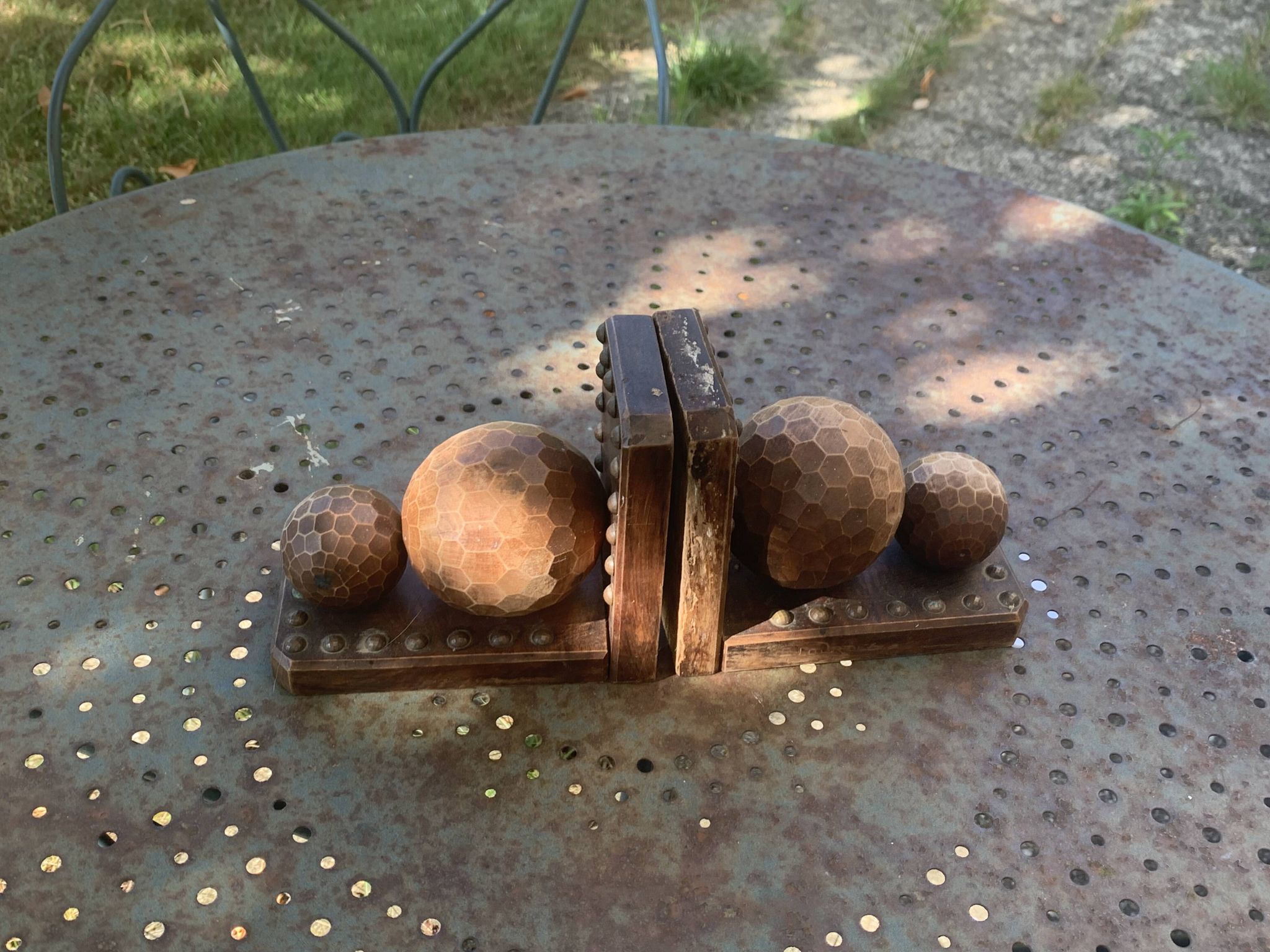 Pair of vintage carved wood and metal ball bookends