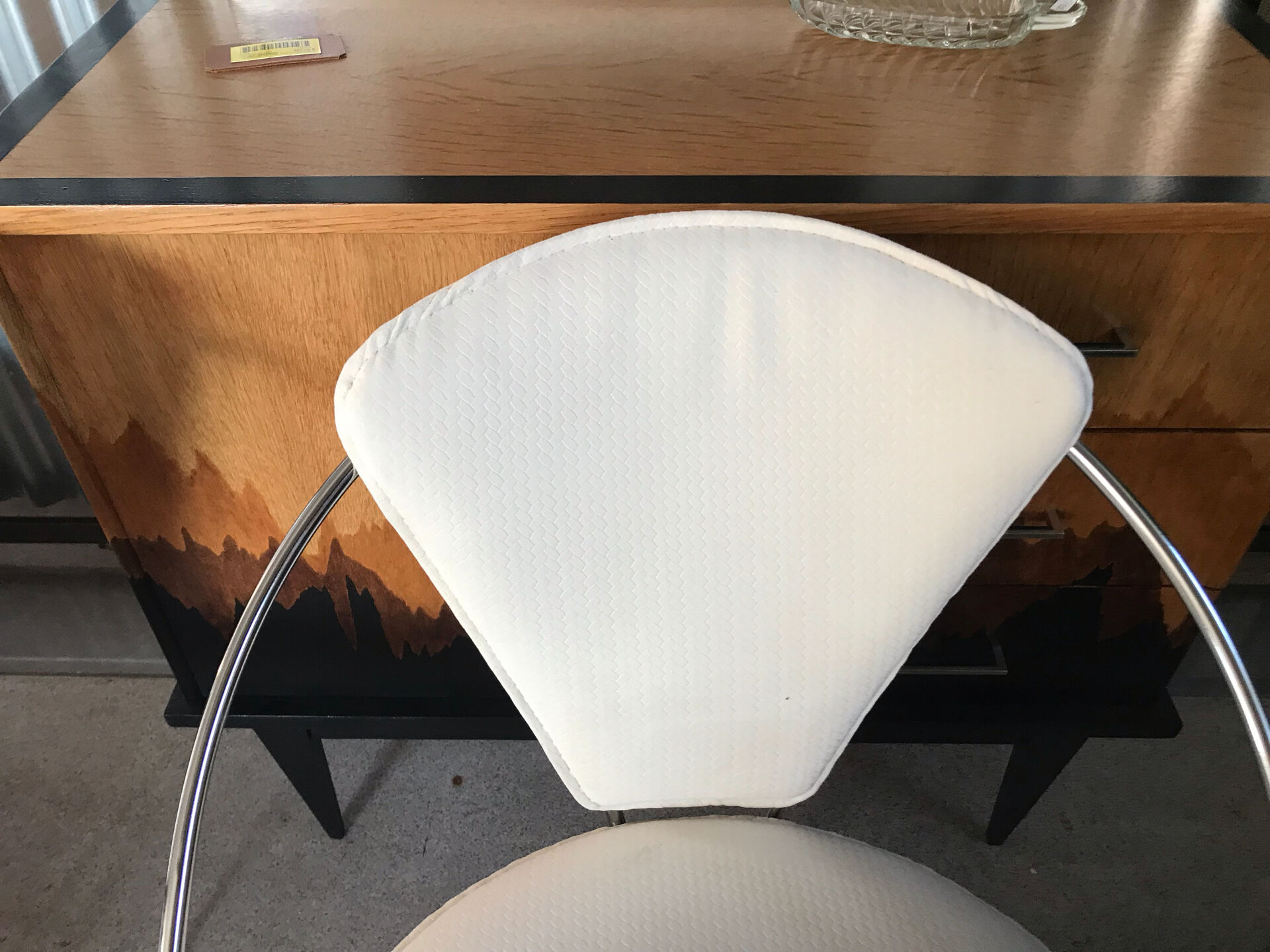 Set of two design chairs in steel and faux leather.