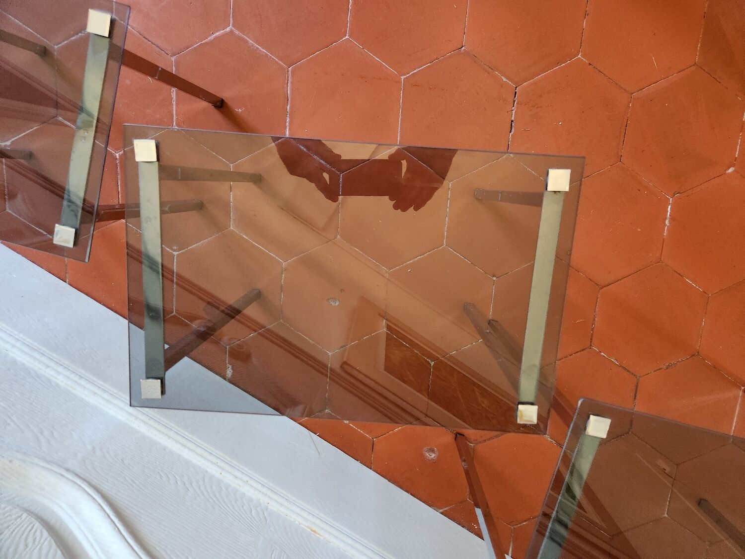 3 nesting tables from the 1970s in smoked glass.