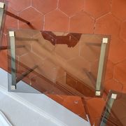 3 nesting tables from the 1970s in smoked glass.