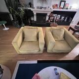 Two yellow Roche Bobois Longislande armchairs.