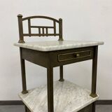 Brass bedside table with a marble top.