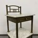Brass bedside table with a marble top.