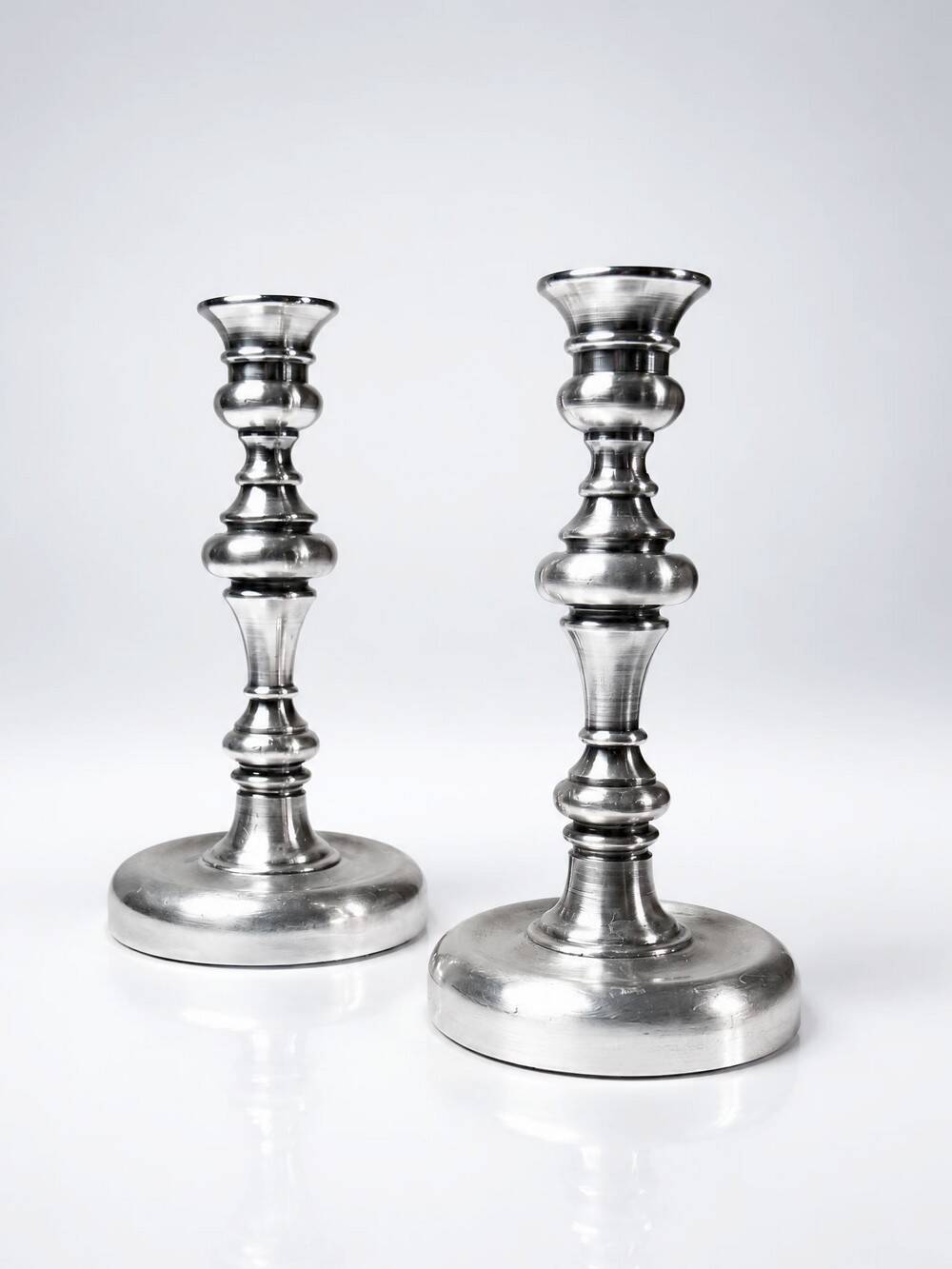 Pair of small antique silver-plated candlesticks, Georgian style.