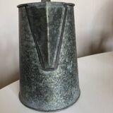 Old garden pitcher vase in folded zinc