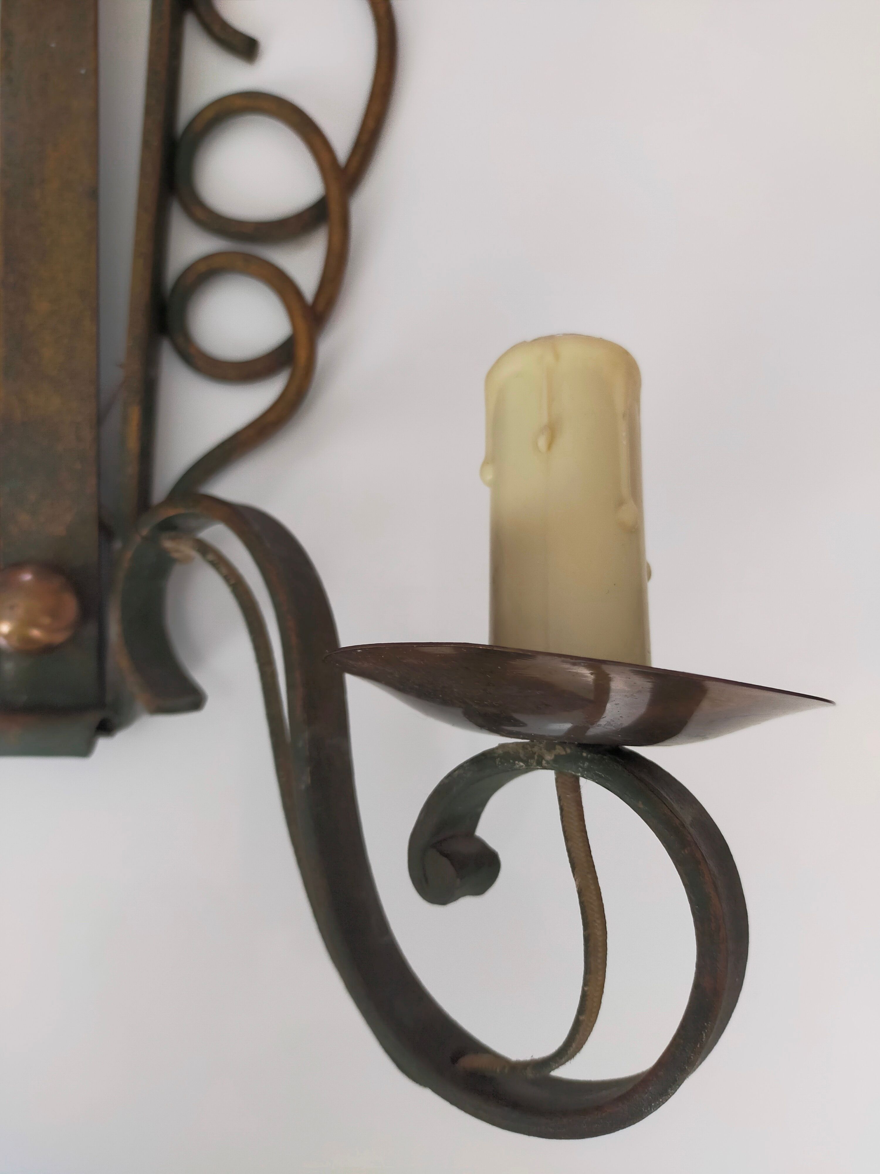 Pairs of vintage wrought iron wall lamps