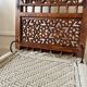 Pair of traditional Indian chairs made of carved wood and rope