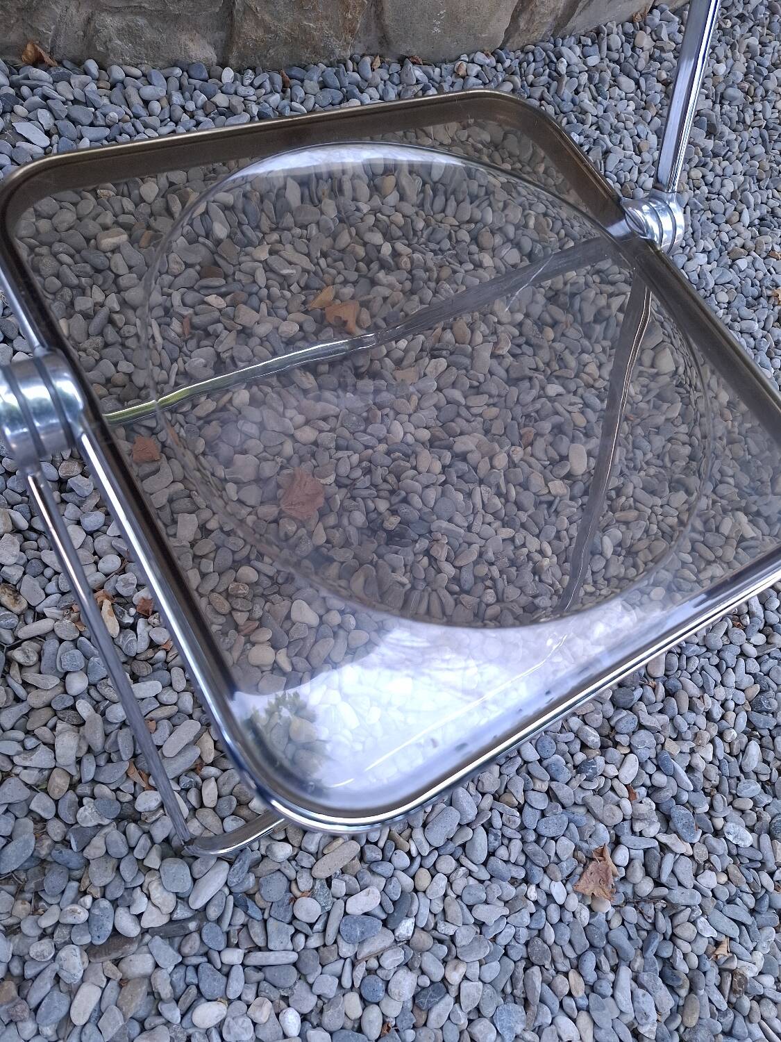 2 folding chairs designed by Giancarlo Piretti for Castelli