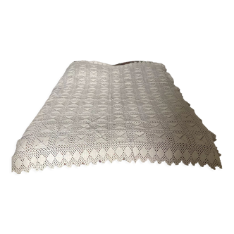 White cotton crochet bed cover with squares