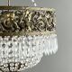 Empire-style chandelier in bronze with crystal pendants, early 20th century.
