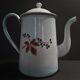 Enamelled sheet metal pourer decorated with black berries early twentieth century
