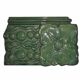 Green enamelled ceramic stove tile — finely sculpted Hungarian pattern from the late 19th century.