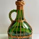 Bouteille en osier et verre