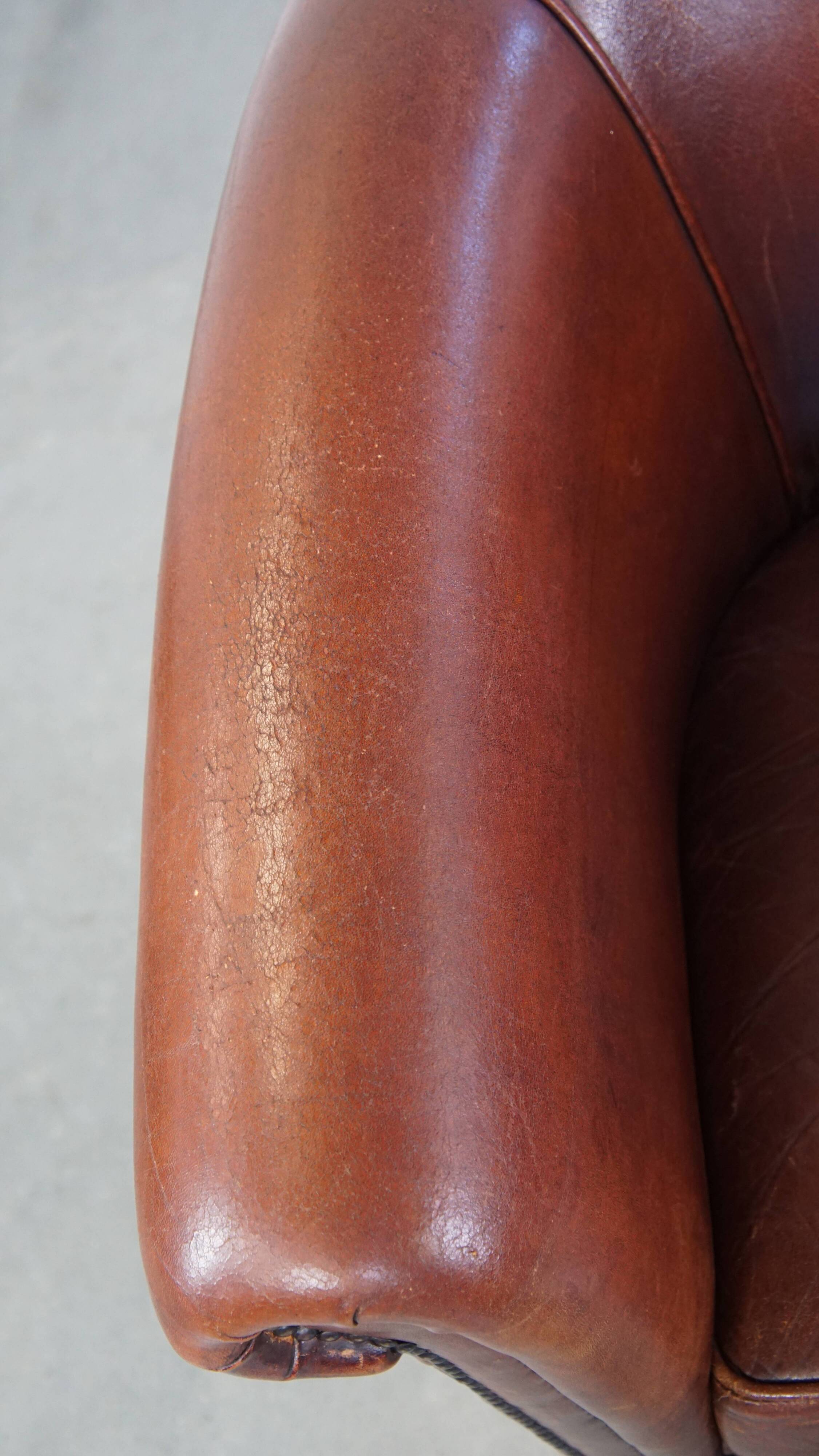 English style sheepskin club chair with a beautiful patina