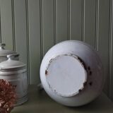 Old enamelled metal jug with gold trim.