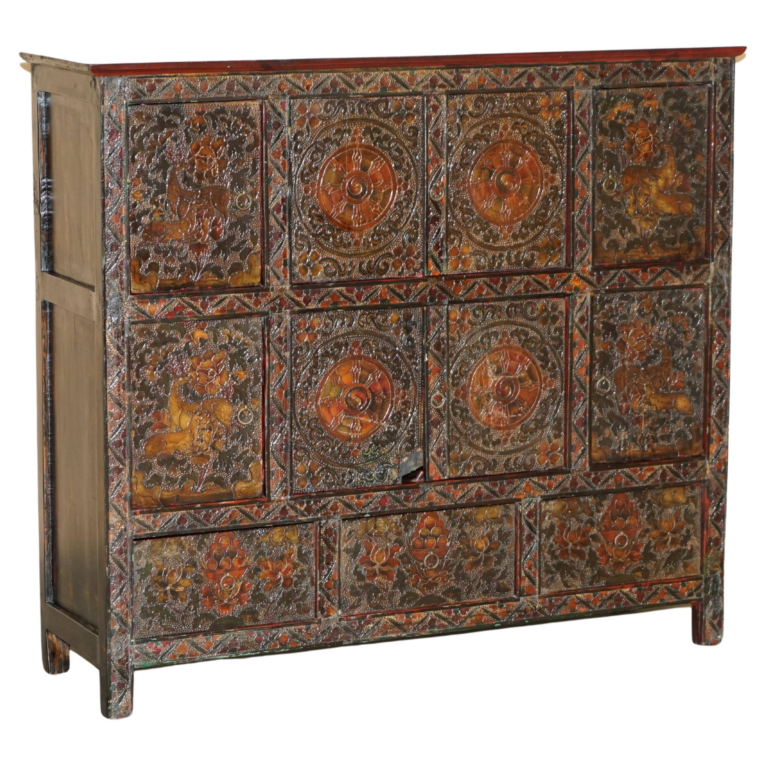 Antique polychrome Tibetan altar cabinet with deer and flowers.