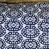 Blue cushion with royal pattern