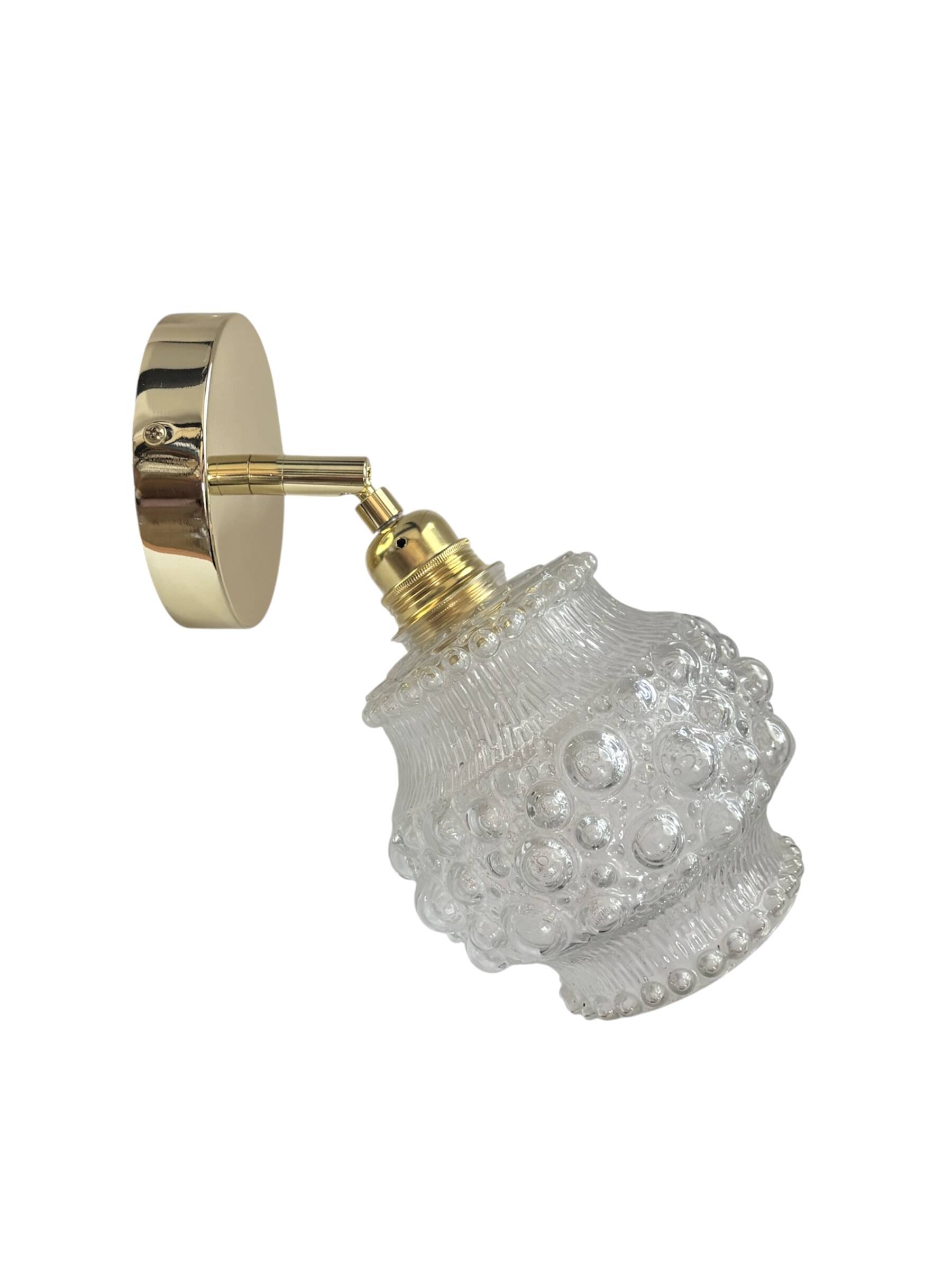 Gold wall light with bubble glass