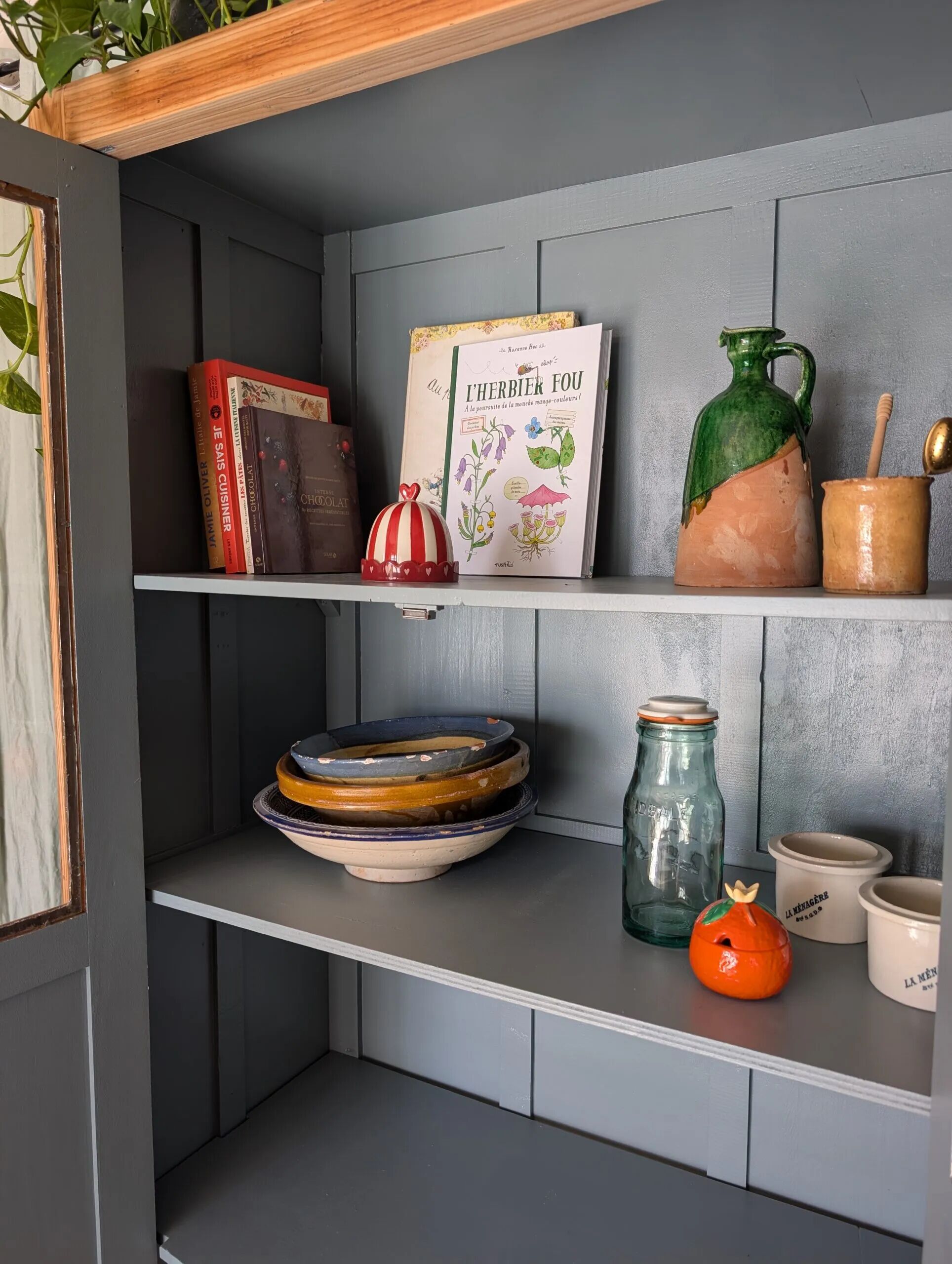 Old glass-fronted wooden library – blue interior