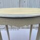 Eggshell-coloured drawer with a cracked effect side table.