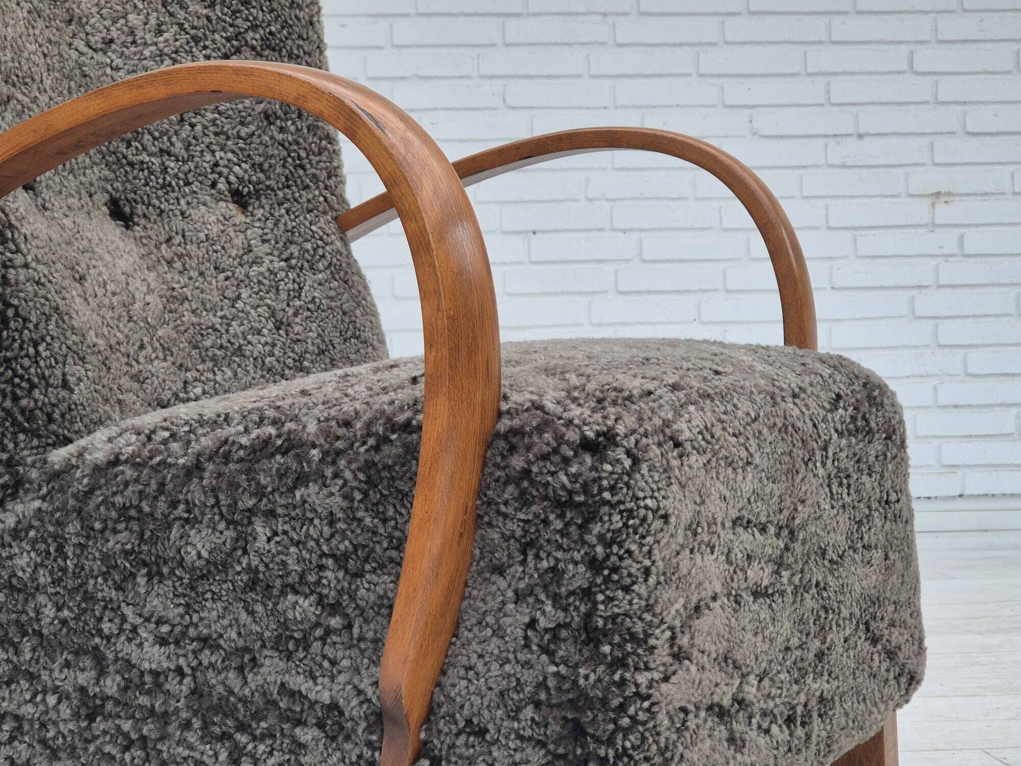 1960s, completely reupholstered Danish art deco armchair, genuine sheepskin "Wellington".