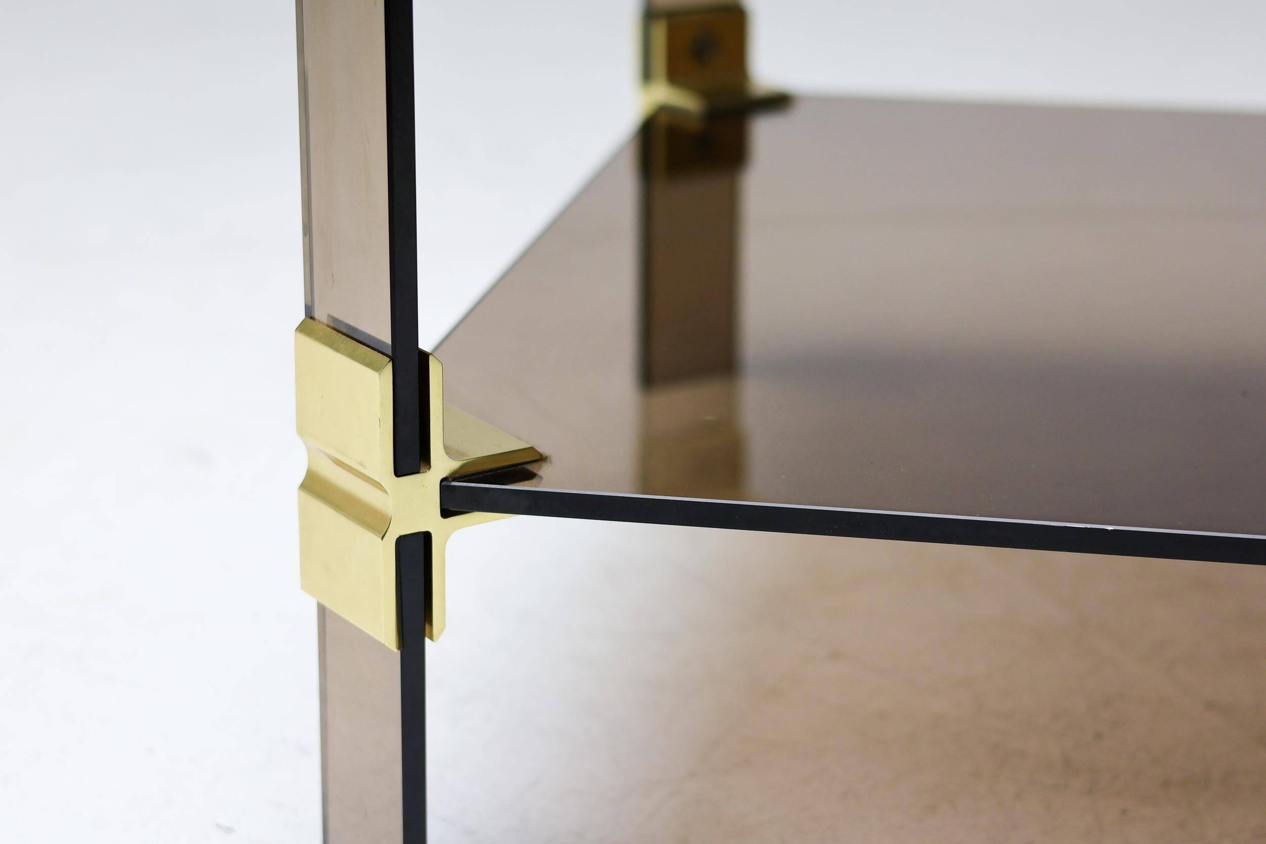 Hollywood Regency coffee table in brass and smoked glass, chic two-tier coffee table.