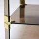 Hollywood Regency coffee table in brass and smoked glass, chic two-tier coffee table.
