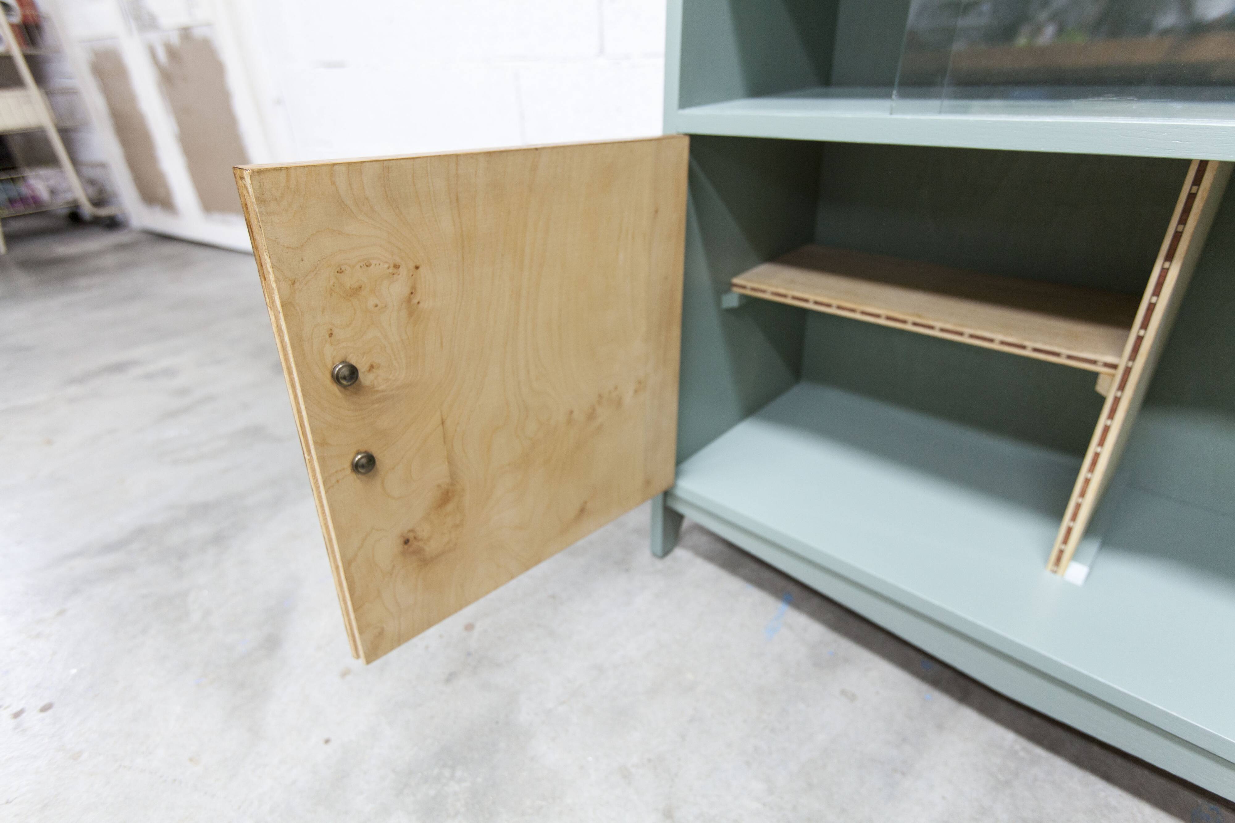 Atypical green noble 1960s low display cabinet.