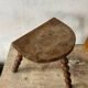 Wooden tripod farm stool