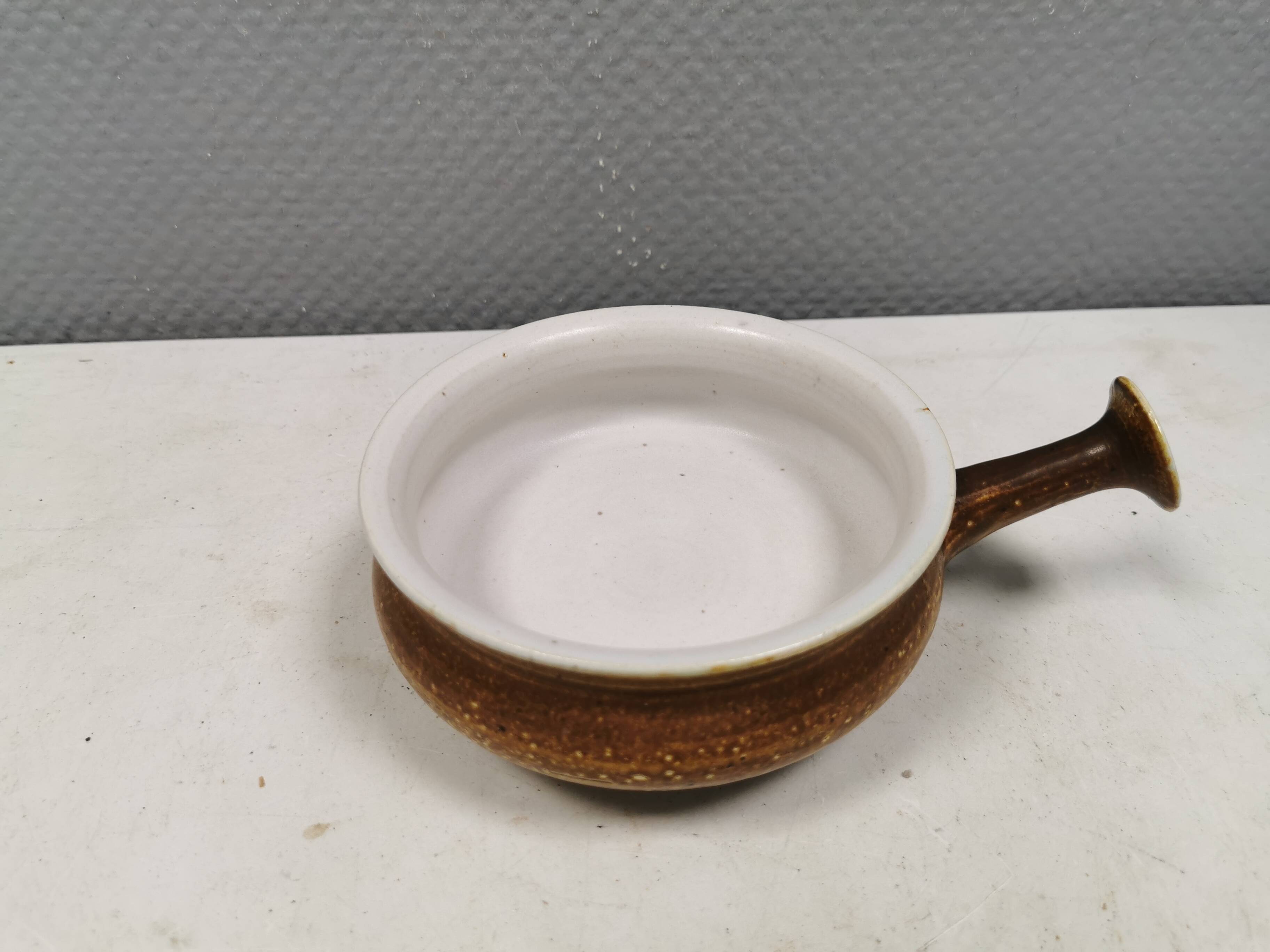 Small ceramic bowl with handle, in golden colours. Danish 1960-70s
