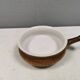 Small ceramic bowl with handle, in golden colours. Danish 1960-70s