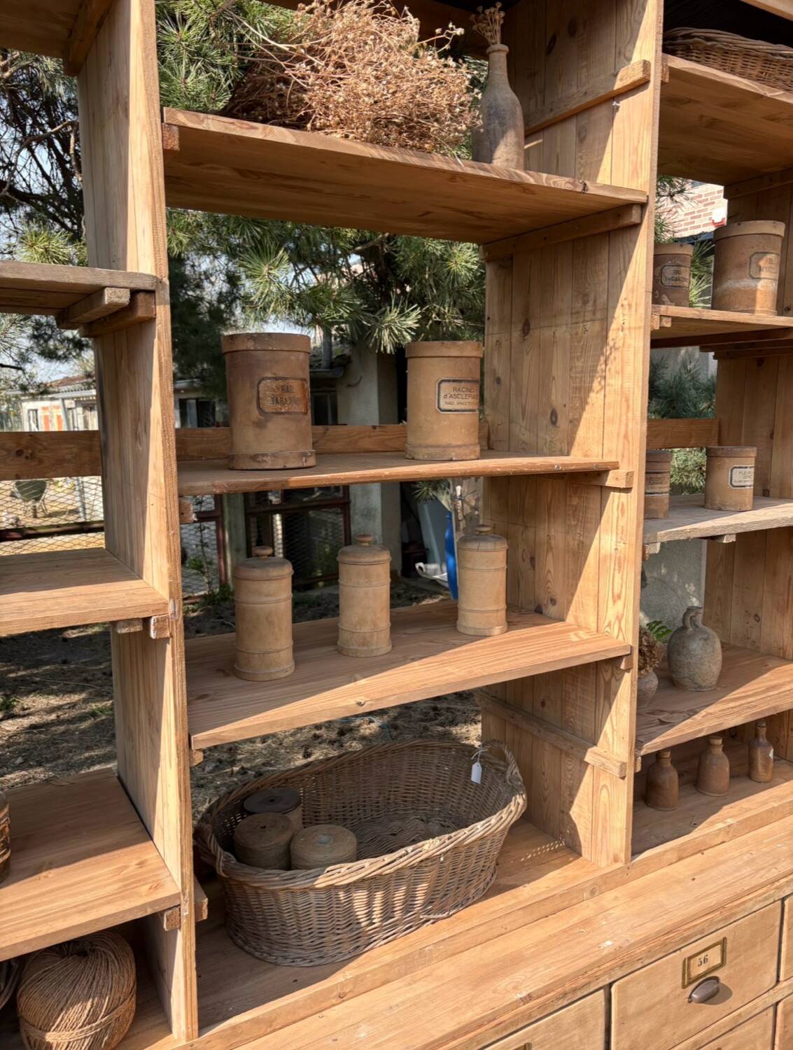 Large antique workshop furniture with drawers and shelves.