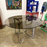 Dining table in chrome metal and smoked glass.