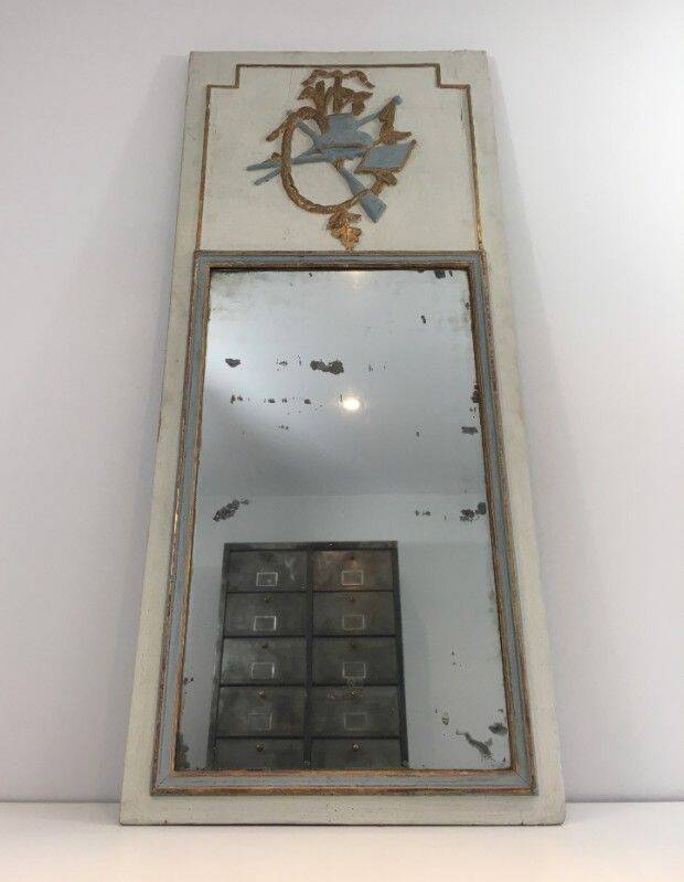 Louis XVI style mirror in patinated carved wood