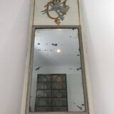 Louis XVI style mirror in patinated carved wood